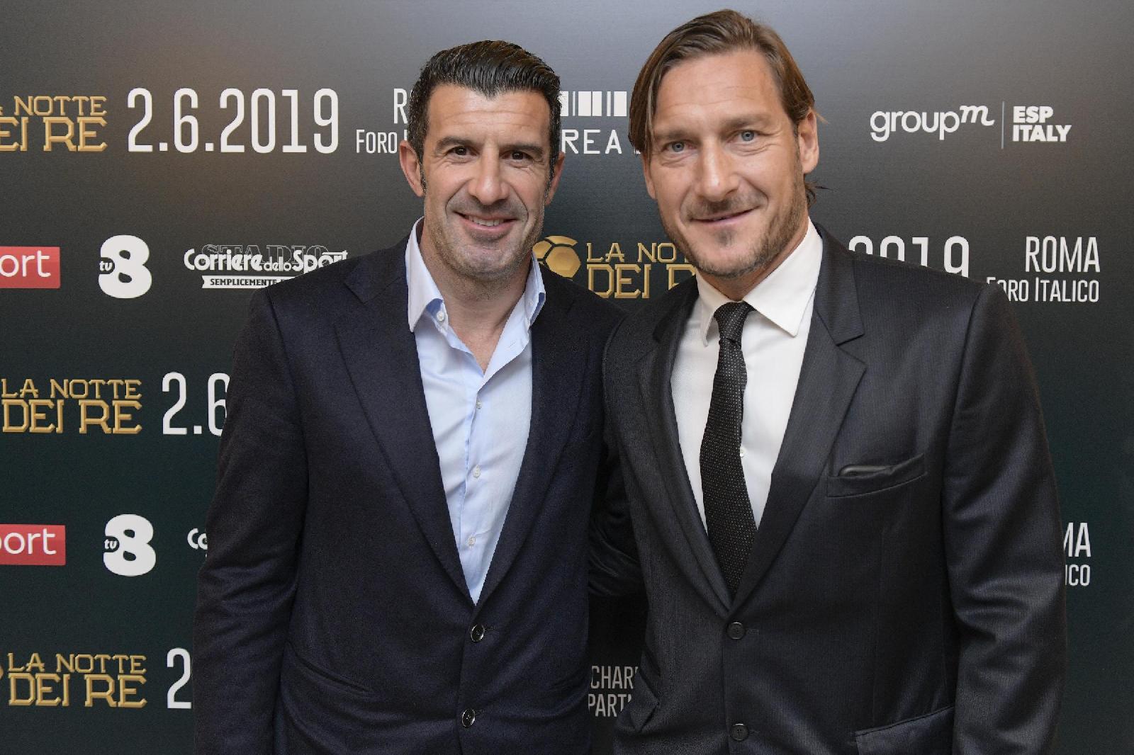 Luìs Figo e Francesco Totti, di LaPresse