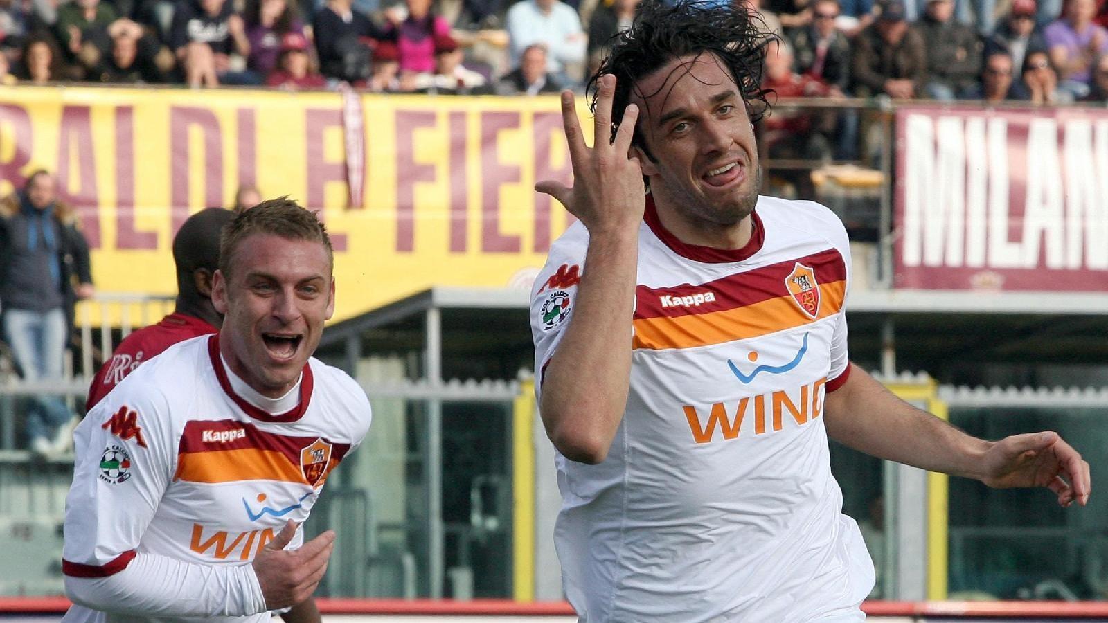 De Rossi e Toni esultano dopo un gol del bomber ©LaPresse