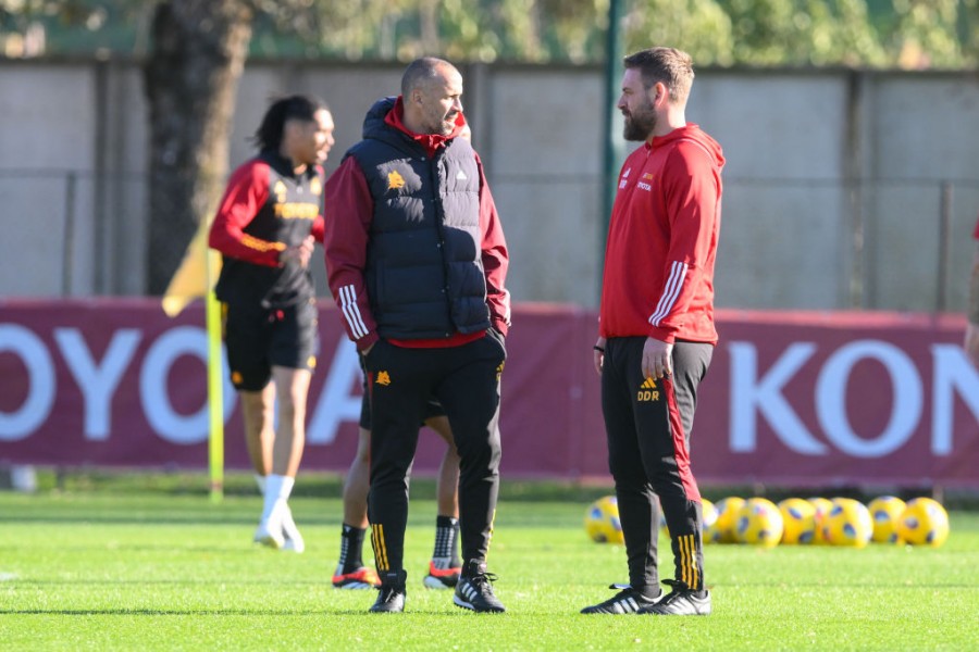 Giacomazzi e De Rossi durante un allenamento della Roma