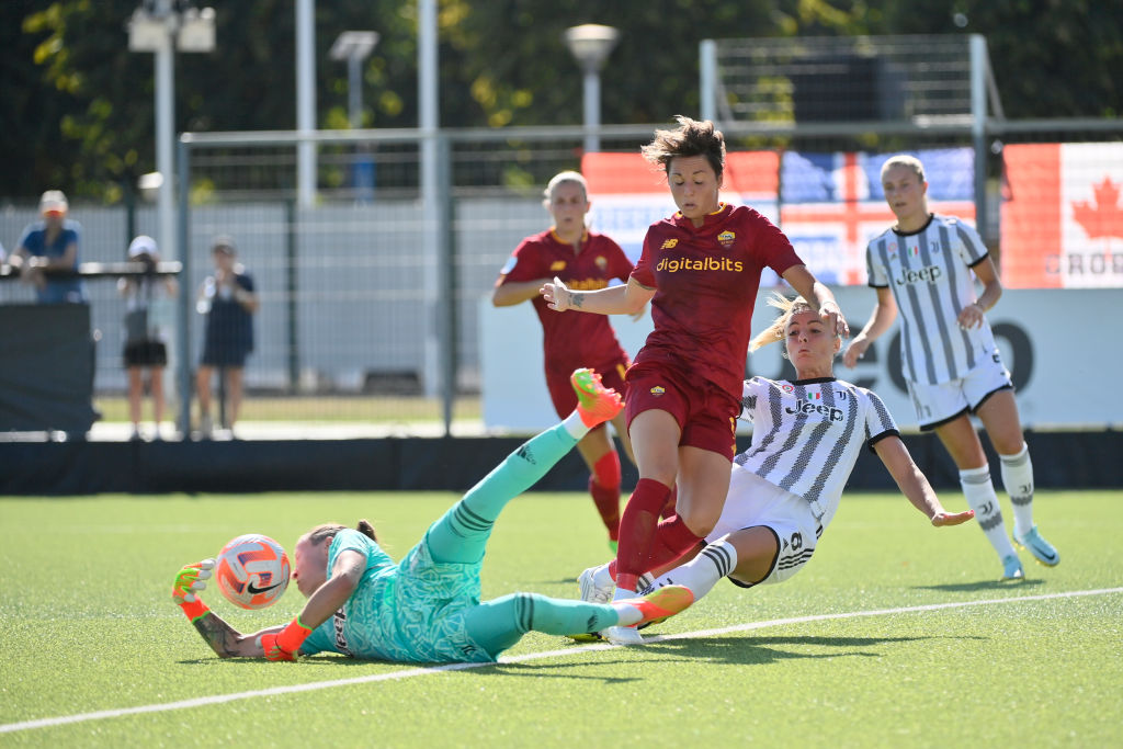 Roma's striker Giacinti being stopped by Peyraud-Magnin