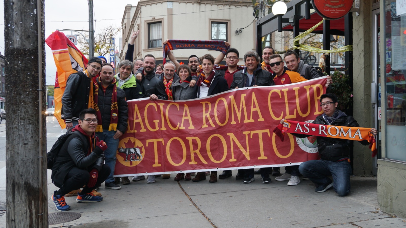 Romanisti from the Roma Club Toronto with their banner